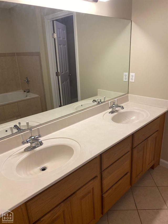 1805 Covey Dr, Jonesboro, AR 72404 - full bath with tile patterned floors, double vanity, and a relaxing tiled tub
