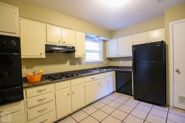 1805 Covey Dr, Jonesboro, AR 72404 - kitchen featuring black appliances, extractor fan, a warming drawer, dark countertops, and light tile patterned floors