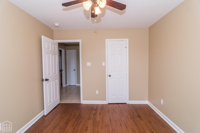 1805 Covey Dr, Jonesboro, AR 72404 - unfurnished bedroom with wood finished floors and ceiling fan