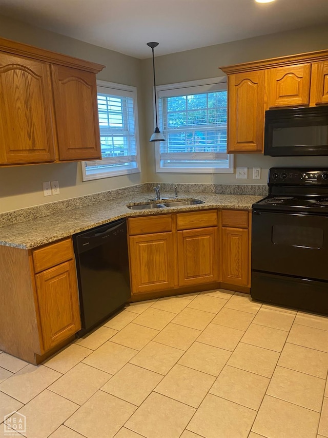 1805 Covey Dr, Jonesboro, AR 72404 - kitchen with black appliances, light tile patterned floors, brown cabinets, and hanging light fixtures