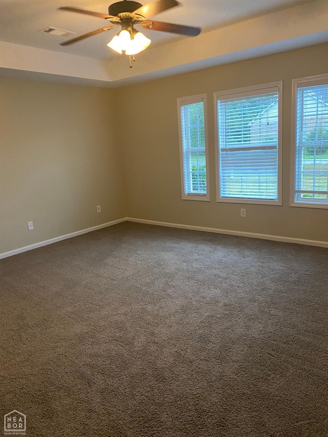 1805 Covey Dr, Jonesboro, AR 72404 - unfurnished room featuring healthy amount of natural light, ceiling fan, and dark colored carpet