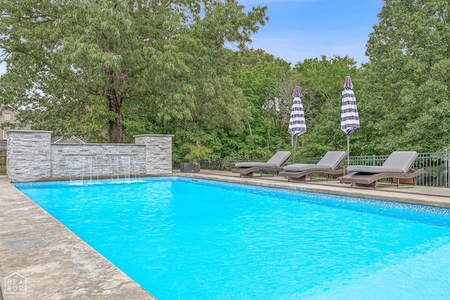 pool featuring fence