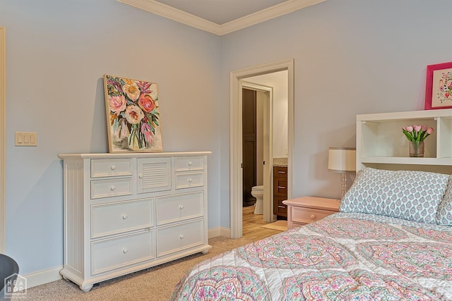 bedroom featuring light colored carpet, connected bathroom, baseboards, and ornamental molding