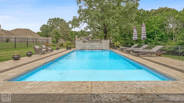 view of swimming pool with a patio area, a fenced in pool, and a fenced backyard