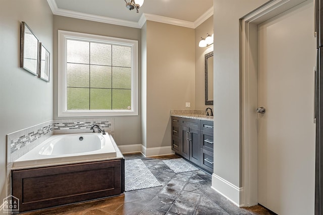 full bath with a garden tub, baseboards, vanity, and ornamental molding