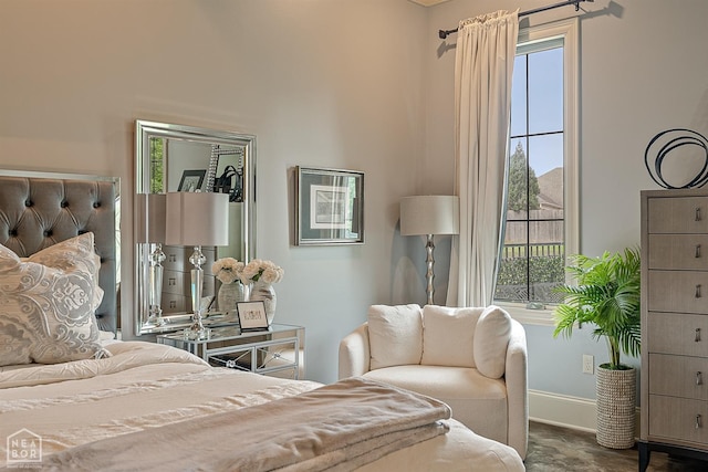 bedroom featuring multiple windows and baseboards