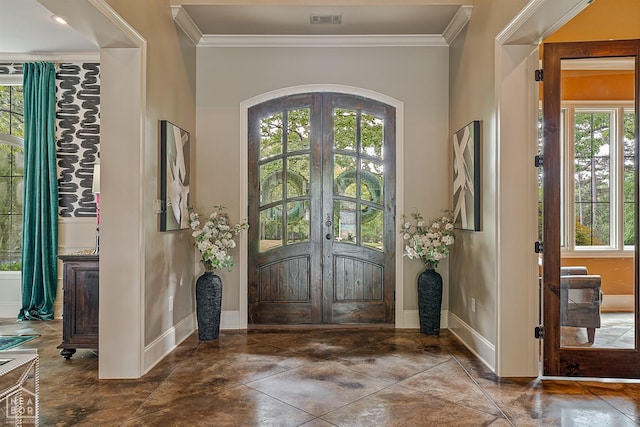 foyer featuring ornamental molding, french doors, and visible vents