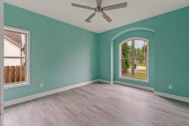 615 W Main St W, Trumann, AR 72472 - empty room featuring wood finished floors, ceiling fan, and baseboards