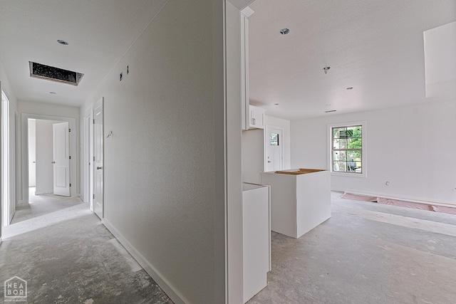 305 Carol Ave, Monette, AR 72447 - hallway featuring concrete floors and a textured wall