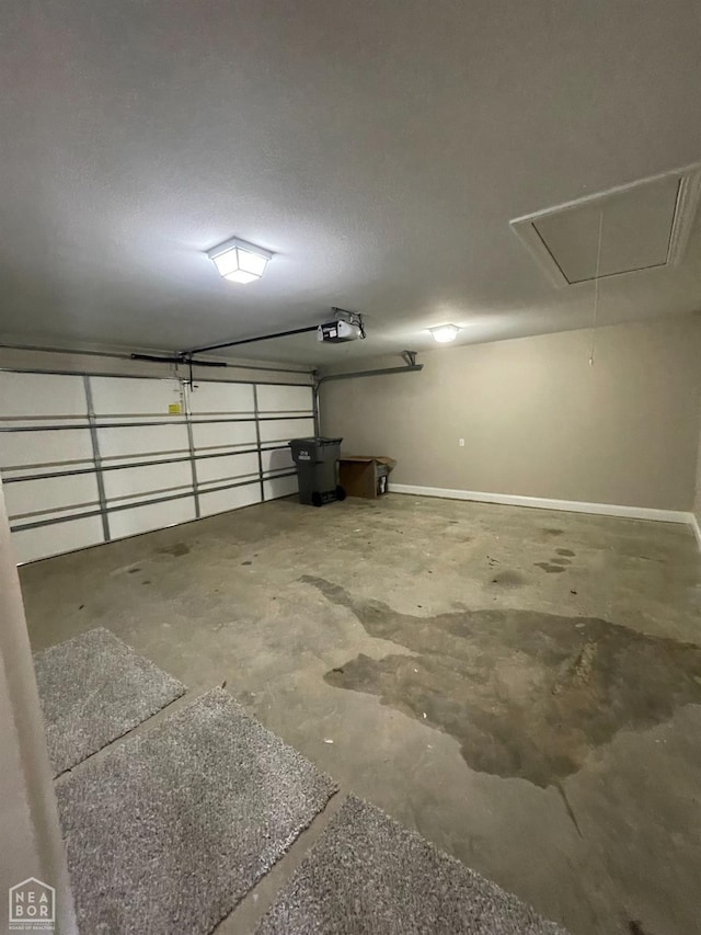 997 Russell Hill Dr, Jonesboro, AR 72404 - garage with baseboards and a garage door opener