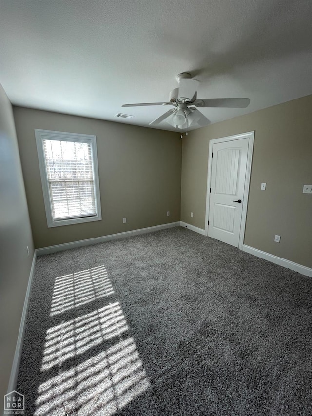 997 Russell Hill Dr, Jonesboro, AR 72404 - carpeted spare room with visible vents, ceiling fan, and baseboards