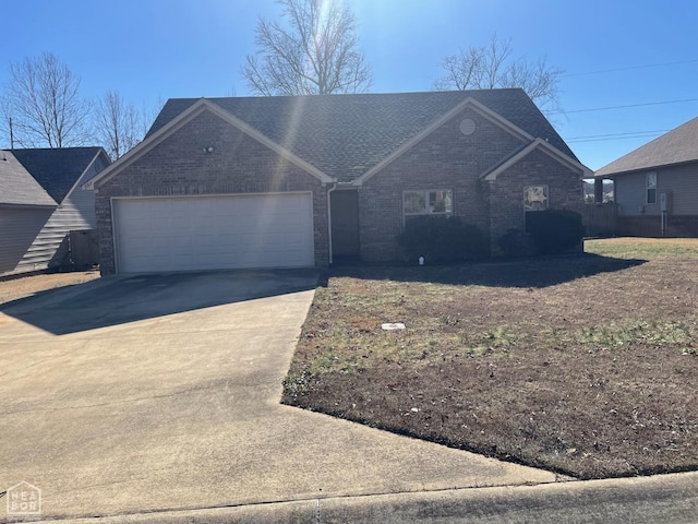 997 Russell Hill Dr, Jonesboro, AR 72404 - single story home with an attached garage, driveway, and brick siding