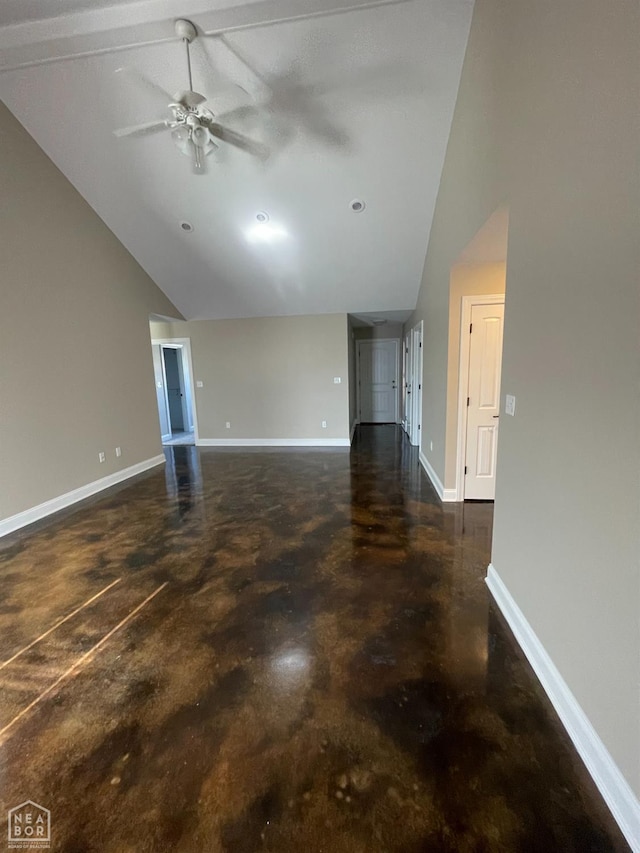 997 Russell Hill Dr, Jonesboro, AR 72404 - unfurnished living room with high vaulted ceiling, finished concrete flooring, baseboards, and ceiling fan