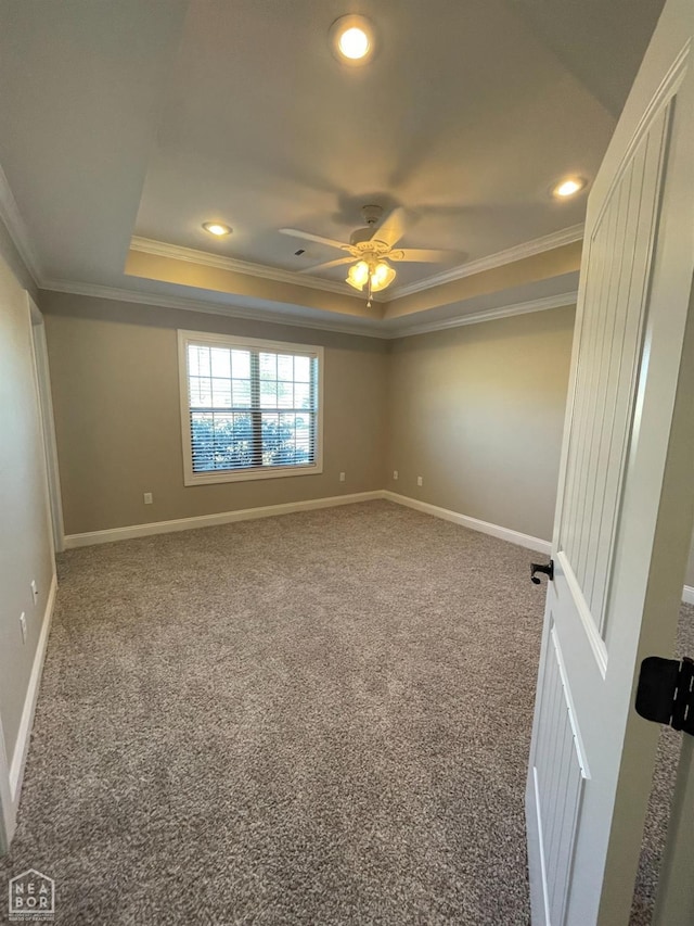 997 Russell Hill Dr, Jonesboro, AR 72404 - carpeted empty room featuring a tray ceiling, crown molding, and baseboards