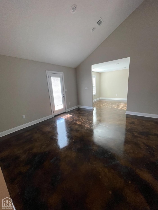 997 Russell Hill Dr, Jonesboro, AR 72404 - empty room with concrete floors, baseboards, and vaulted ceiling