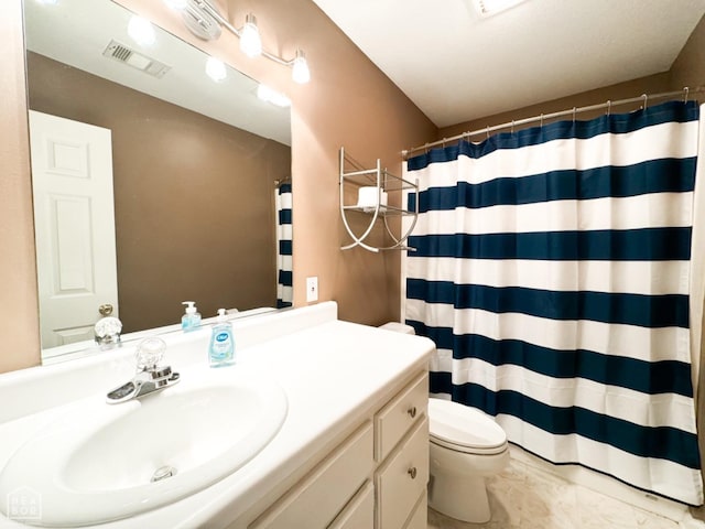 full bath with marble finish floors, vanity, toilet, and a shower with curtain
