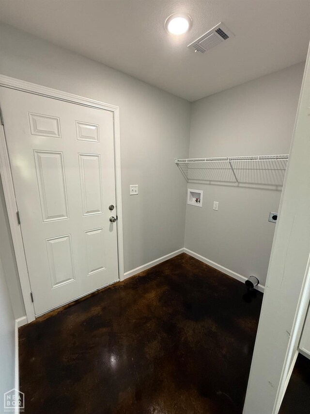 704 N Ozark St, Trumann, AR 72472 - laundry area with baseboards and washer hookup