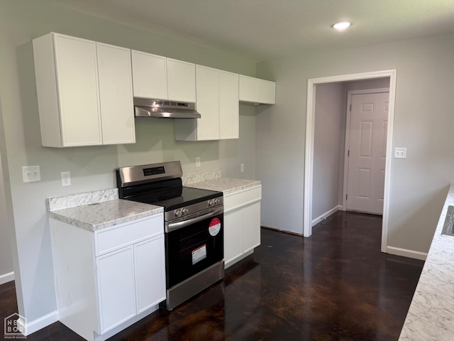 704 N Ozark St, Trumann, AR 72472 - kitchen with stainless steel electric range oven, light countertops, white cabinetry, under cabinet range hood, and recessed lighting