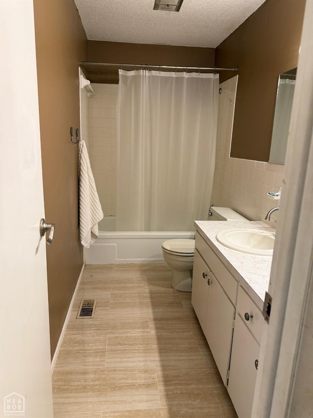 1304 Dana Debbie St, Jonesboro, AR 72405 - full bathroom with vanity, shower / tub combo, a textured ceiling, tile walls, and wood finished floors