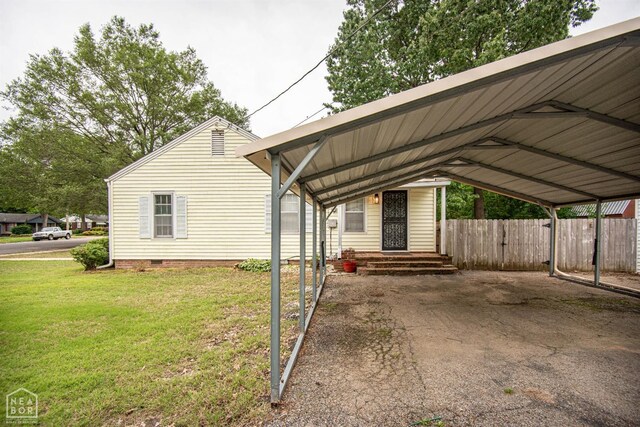 1123 Olive St, Jonesboro, AR 72401 - view of vehicle parking featuring a detached carport
