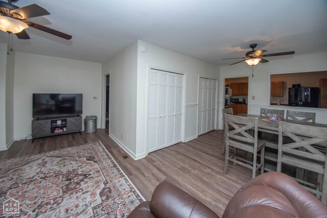 1123 Olive St, Jonesboro, AR 72401 - living room with ceiling fan, wood finished floors, and baseboards