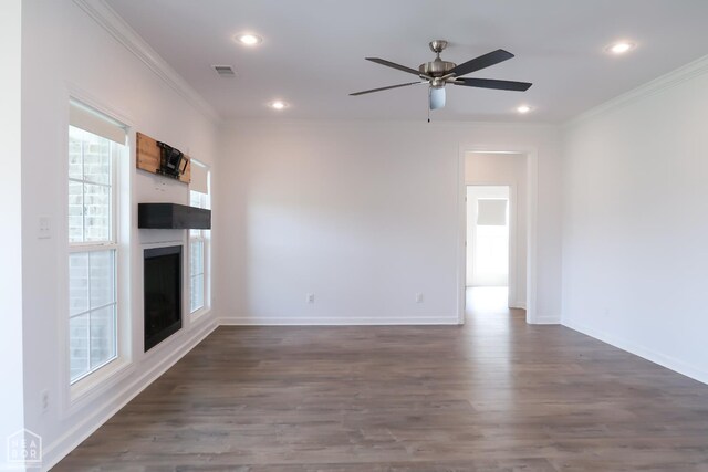 113 Hidden Creek Dr, Brookland, AR 72417 - unfurnished living room featuring a fireplace, crown molding, healthy amount of natural light, wood finished floors, and recessed lighting