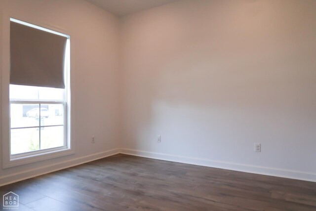 113 Hidden Creek Dr, Brookland, AR 72417 - spare room featuring baseboards and dark wood-type flooring