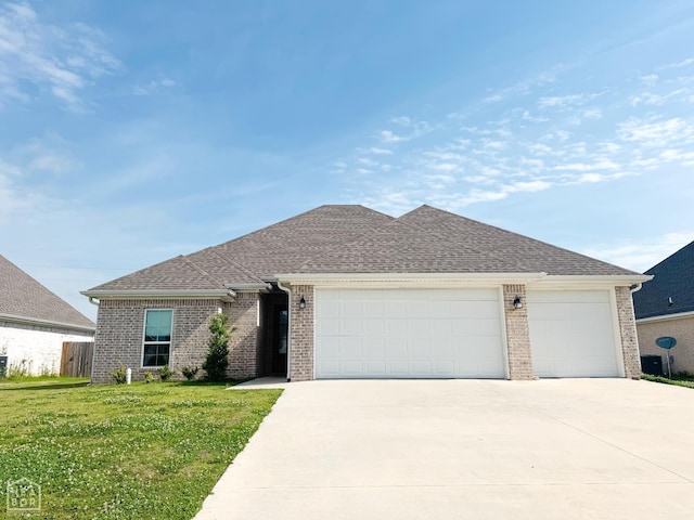 113 Hidden Creek Dr, Brookland, AR 72417 - view of front of property with concrete driveway, an attached garage, brick siding, and roof with shingles