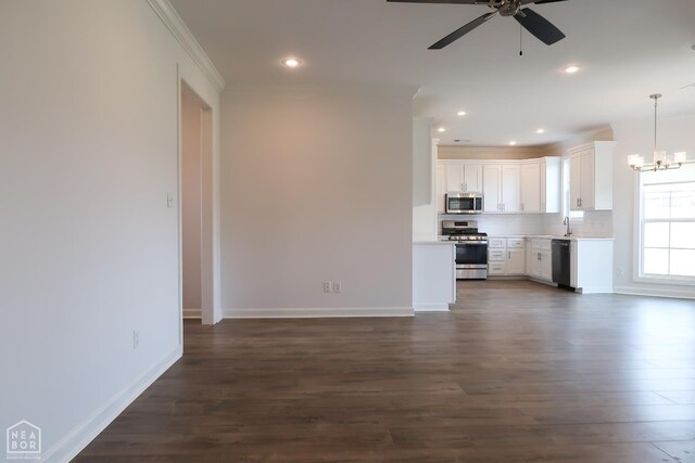 113 Hidden Creek Dr, Brookland, AR 72417 - unfurnished living room with ceiling fan, dark wood-style flooring, a chandelier, recessed lighting, and a sink