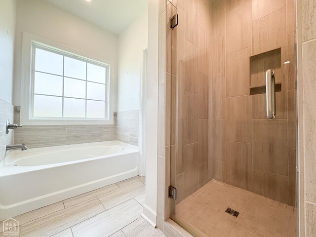 113 Hidden Creek Dr, Brookland, AR 72417 - bathroom with a stall shower and a bath