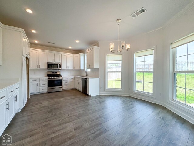 113 Hidden Creek Dr, Brookland, AR 72417 - kitchen featuring stainless steel appliances, plenty of natural light, a chandelier, crown molding, and recessed lighting