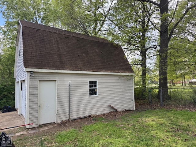 exterior space with an outbuilding and fence