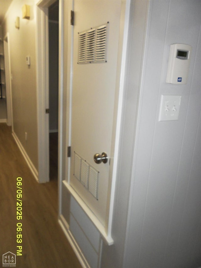 404 Logan St, Newport, AR 72112 - corridor featuring wood finished floors and baseboards