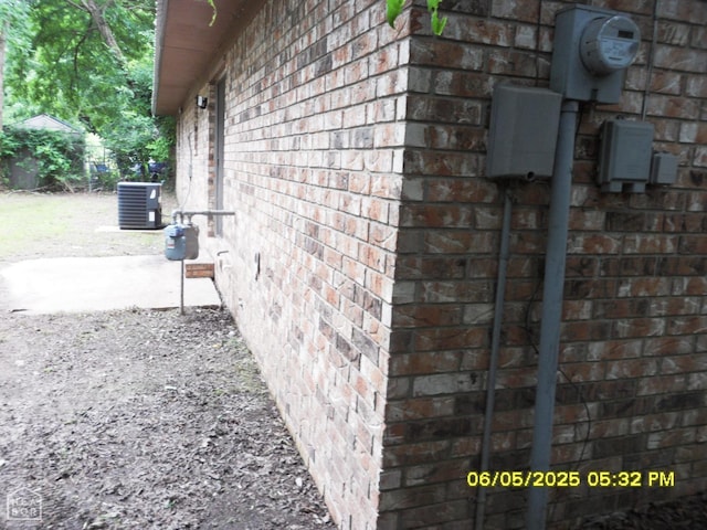 404 Logan St, Newport, AR 72112 - view of property exterior with brick siding and central AC