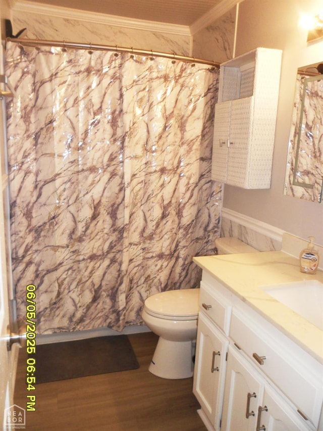 404 Logan St, Newport, AR 72112 - full bathroom with vanity, toilet, wood finished floors, ornamental molding, and a shower with shower curtain