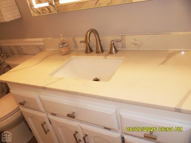 404 Logan St, Newport, AR 72112 - bathroom featuring toilet and vanity