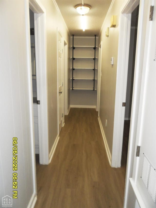 404 Logan St, Newport, AR 72112 - hall featuring crown molding, wood finished floors, and baseboards