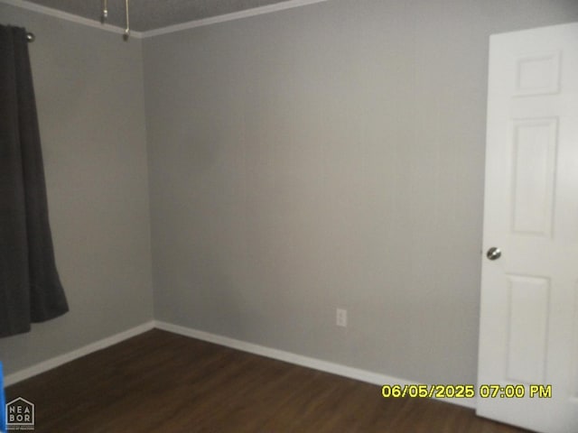 404 Logan St, Newport, AR 72112 - spare room with dark wood-style flooring and baseboards