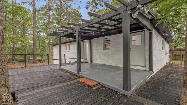 deck with a pergola and fence