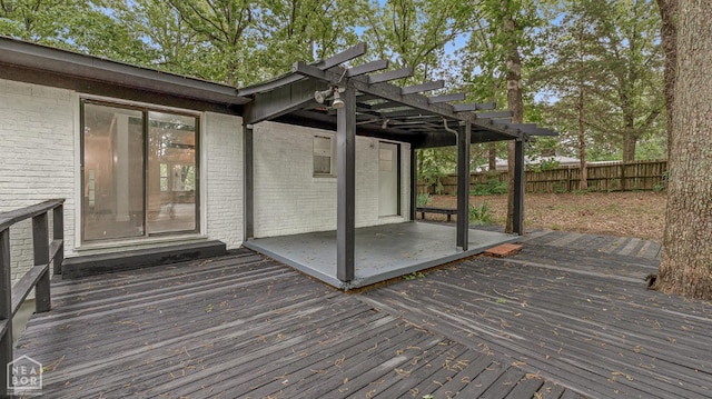 wooden terrace with a pergola and fence