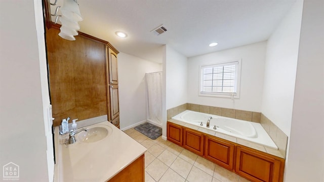 full bath with vanity, recessed lighting, tile patterned floors, visible vents, and a garden tub