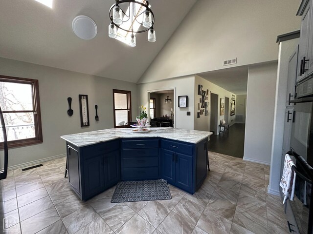 13534 Mc 8001, Yellville, AR 72687 - kitchen with baseboards, oven, high vaulted ceiling, and blue cabinets
