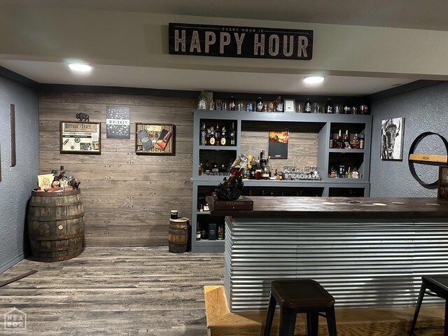 13534 Mc 8001, Yellville, AR 72687 - bar with a bar, wooden walls, wood finished floors, and a textured wall