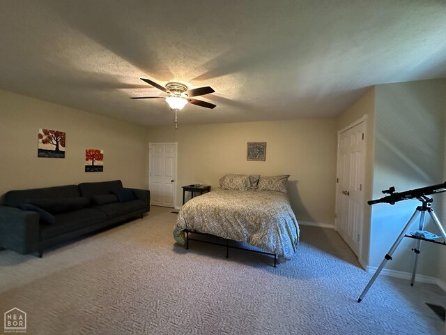 13534 Mc 8001, Yellville, AR 72687 - carpeted bedroom featuring a textured ceiling, baseboards, and a ceiling fan
