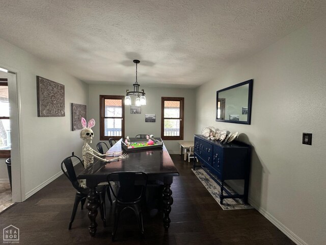 13534 Mc 8001, Yellville, AR 72687 - dining space featuring a textured ceiling, baseboards, dark wood finished floors, and a notable chandelier
