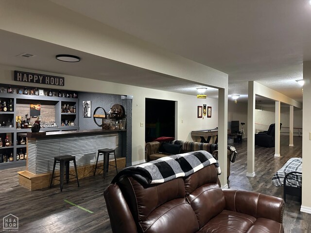 13534 Mc 8001, Yellville, AR 72687 - living area featuring dark wood-type flooring, a bar, and baseboards