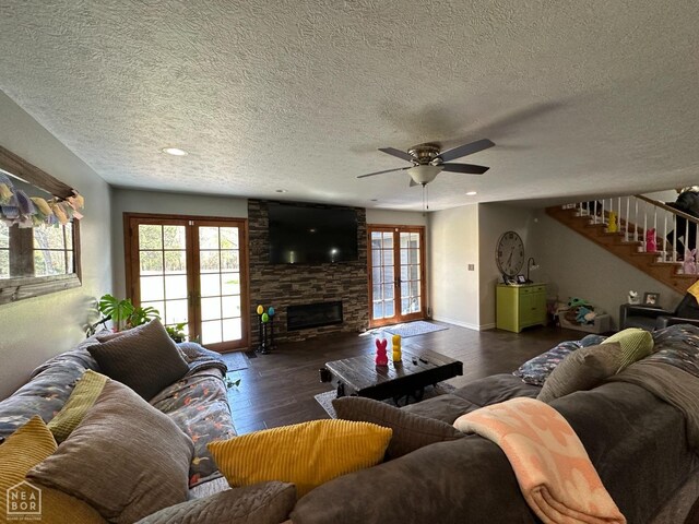 13534 Mc 8001, Yellville, AR 72687 - living area with wood finished floors, a fireplace, plenty of natural light, and stairs