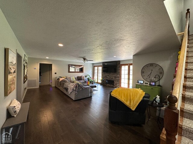 13534 Mc 8001, Yellville, AR 72687 - living room featuring a fireplace, dark wood-style flooring, and a textured ceiling
