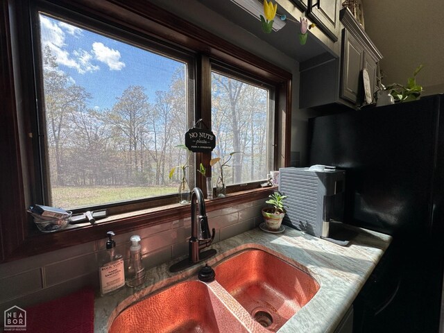13534 Mc 8001, Yellville, AR 72687 - room details with tasteful backsplash, freestanding refrigerator, and a sink