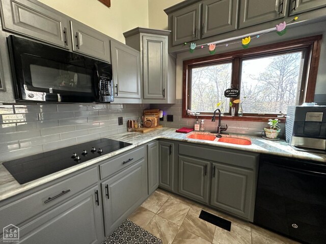 13534 Mc 8001, Yellville, AR 72687 - kitchen with a sink, gray cabinets, backsplash, and black appliances